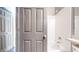 Bathroom featuring vanity with sink, tub, shower head and tile surround at 15926 Butterwort Cir, Parker, CO 80134