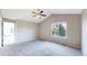Bedroom with vaulted ceiling, carpet flooring, and a window that brings in lots of natural light at 15926 Butterwort Cir, Parker, CO 80134