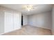 Bedroom with carpet, ceiling fan, and closet with sliding doors at 15926 Butterwort Cir, Parker, CO 80134