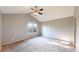 Spacious bedroom with vaulted ceiling, carpet flooring, and a window providing natural light at 15926 Butterwort Cir, Parker, CO 80134