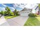 Wide driveway leading to a home featuring a two-car garage at 15926 Butterwort Cir, Parker, CO 80134