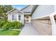 Home featuring a decorative brick wall and well-manicured landscaping at 15926 Butterwort Cir, Parker, CO 80134
