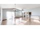 Spacious living room featuring hardwood floors and many large windows at 15926 Butterwort Cir, Parker, CO 80134