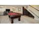 Finished basement with a pool table, wine rack, and tiled bar area at 10914 W Coco Pl, Littleton, CO 80127