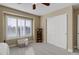Bright bedroom featuring neutral walls, shutters, closet, and carpet at 10914 W Coco Pl, Littleton, CO 80127