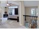 Spacious bedroom featuring vaulted ceilings, a ceiling fan, and a sliding glass door leading to a balcony at 10914 W Coco Pl, Littleton, CO 80127