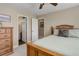 Bedroom with ensuite bathroom and views to the hallway at 10914 W Coco Pl, Littleton, CO 80127