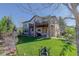 Beautiful two-story home with large backyard featuring a covered patio, ideal for entertaining at 10914 W Coco Pl, Littleton, CO 80127