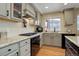 Well-equipped kitchen with granite countertops, stainless steel appliances, and ample cabinet space at 10914 W Coco Pl, Littleton, CO 80127