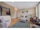 Open living room with wrought iron staircase and comfortable seating at 10914 W Coco Pl, Littleton, CO 80127