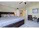 Comfortable bedroom with soft carpet, a ceiling fan, and light-colored walls at 10914 W Coco Pl, Littleton, CO 80127