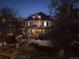 Beautiful home exterior at night with warm lighting and snow on the ground at 750 N Clarkson St, Denver, CO 80218