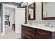 Double vanity bathroom with marble countertops and additional storage at 750 N Clarkson St, Denver, CO 80218