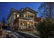 Elegant two-story home with classic architecture, lit at night at 750 N Clarkson St, Denver, CO 80218