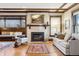 Bright living room featuring a fireplace and large windows at 750 N Clarkson St, Denver, CO 80218