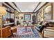 Bright living room with hardwood floors, a built-in bench, and a fireplace at 750 N Clarkson St, Denver, CO 80218