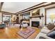 Large living room with hardwood floors, fireplace, and ample seating at 750 N Clarkson St, Denver, CO 80218