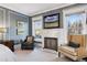 Main bedroom sitting area with fireplace and comfortable armchairs at 750 N Clarkson St, Denver, CO 80218