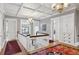 Bright upper hallway with hardwood floors and elegant chandeliers at 750 N Clarkson St, Denver, CO 80218