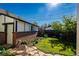 Well-maintained backyard with lush lawn, landscaping, and a tidy exterior at 1836 S Grant St, Denver, CO 80210