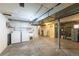 Unfinished basement with exposed ductwork, laundry area, and ample space for storage at 1836 S Grant St, Denver, CO 80210