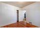 Bedroom featuring hardwood floors and white walls, offering a clean and spacious feel at 1836 S Grant St, Denver, CO 80210