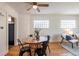 Bright dining area featuring a round table, modern chairs, and unique glass block windows at 1836 S Grant St, Denver, CO 80210