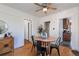 Dining room with hardwood floors features a round wood table with black chairs and a vintage cabinet at 1836 S Grant St, Denver, CO 80210