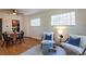 Bright living area with hardwood floors, glass block windows, and modern seating at 1836 S Grant St, Denver, CO 80210