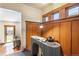 Home office with built-in shelving and a unique desk, bathed in natural light at 1836 S Grant St, Denver, CO 80210