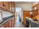 Stylish office space flows into the entryway and features custom wood cabinets with granite countertops at 1836 S Grant St, Denver, CO 80210