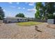 Spacious backyard featuring a gravel area, patch of grass, storage shed, and privacy fence at 13225 Grove Way, Broomfield, CO 80020