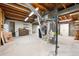 Unfinished basement with concrete floor, exposed ducts, and water heater at 13225 Grove Way, Broomfield, CO 80020