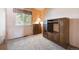 Cozy bedroom featuring carpet, a window, and wooden furniture at 13225 Grove Way, Broomfield, CO 80020