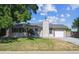 Quaint single-Gathering home featuring lush greenery, a tidy lawn, and a welcoming entrance on a sunny day at 13225 Grove Way, Broomfield, CO 80020