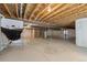 Unfinished basement with exposed ceiling, concrete flooring, and an open canvas at 15414 Xenia Ct, Thornton, CO 80602