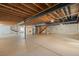 Unfinished basement with open rafters, concrete flooring, and potential for customization at 15414 Xenia Ct, Thornton, CO 80602