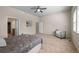 Spacious bedroom showcasing a comfortable seating area, ample natural light, and plush carpeting at 15414 Xenia Ct, Thornton, CO 80602
