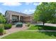 Charming home featuring a well-manicured lawn and stone accents, offering curb appeal at 15414 Xenia Ct, Thornton, CO 80602