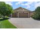 Spacious three-car garage providing ample parking and storage space for homeowners at 15414 Xenia Ct, Thornton, CO 80602
