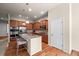 Modern kitchen with stainless steel appliances, granite counters, and a functional island with bar seating at 15414 Xenia Ct, Thornton, CO 80602