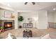 Comfortable living room showcasing a stone fireplace, stylish decor, and a calming ambiance at 15414 Xenia Ct, Thornton, CO 80602
