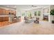 Open concept living room featuring hardwood floors, fireplace, and seamless flow to the kitchen at 15414 Xenia Ct, Thornton, CO 80602