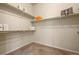 Bright walk-in closet with carpet and built-in shelving ready for optimal organization at 15414 Xenia Ct, Thornton, CO 80602