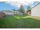 Picture of backyard featuring lawn, shed, clothesline and patio at 4933 S Xenon Ct, Morrison, CO 80465