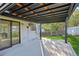Backyard patio with large deck cover, built in shade and outdoor entertainment area at 4933 S Xenon Ct, Morrison, CO 80465