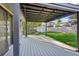 Backyard patio with large deck cover, built in shade and outdoor entertainment area at 4933 S Xenon Ct, Morrison, CO 80465