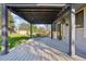 Backyard patio with large deck cover, built in shade and outdoor entertainment area at 4933 S Xenon Ct, Morrison, CO 80465
