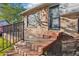 Welcoming brick front porch with steps leading to the entrance, showcasing its charm at 4933 S Xenon Ct, Morrison, CO 80465