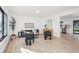 Bright living room featuring modern decor, hardwood floors, and an open layout at 4933 S Xenon Ct, Morrison, CO 80465